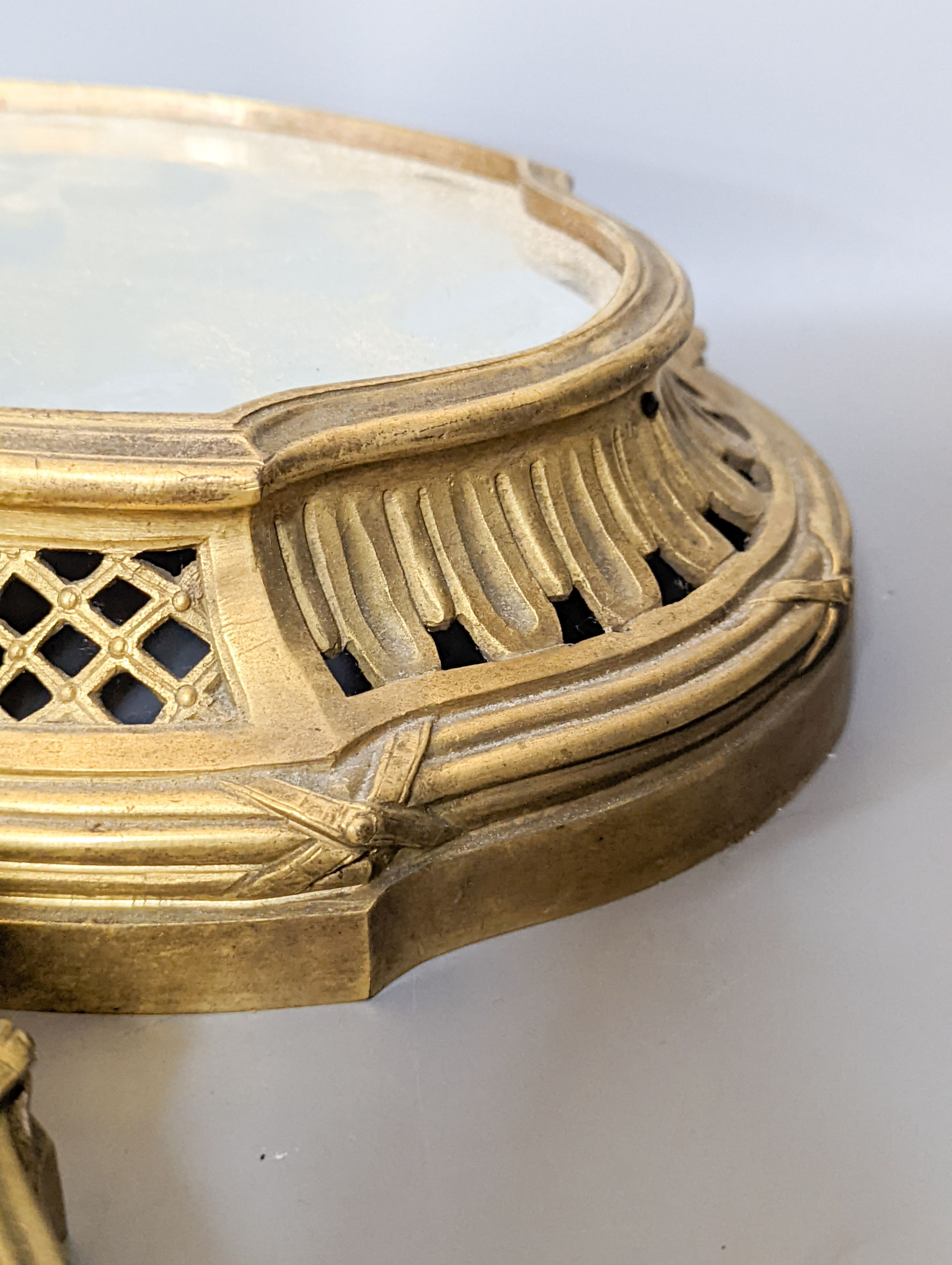 A pair of mirrored ormolu plateaus, 28cm